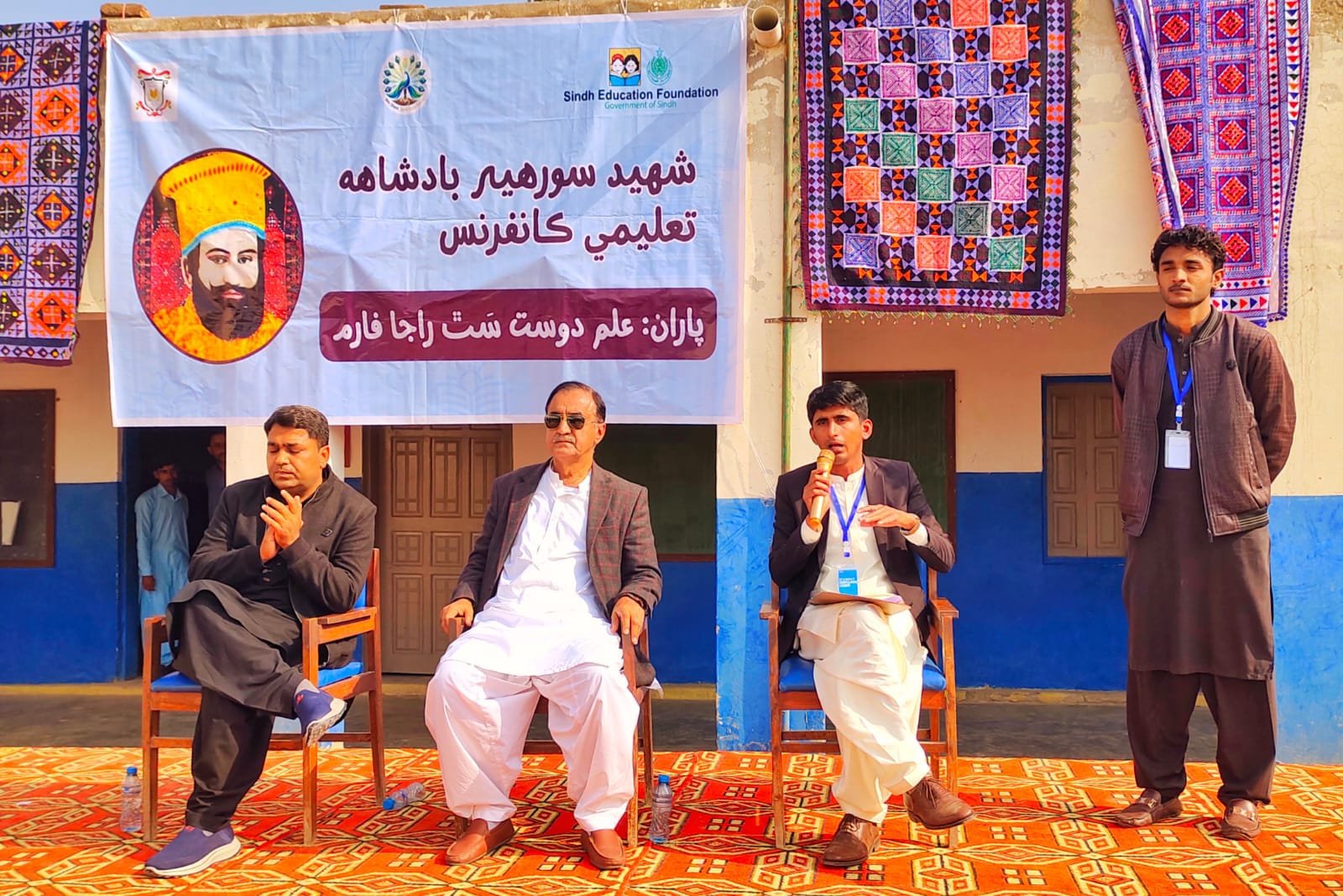 Education gathering in Sindh, with a speaker addressing the audience