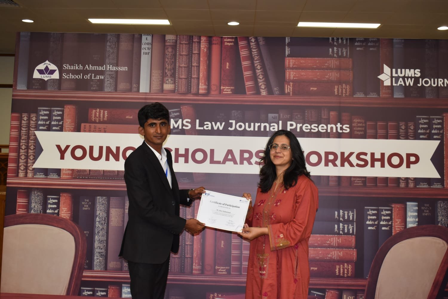 Presentation of a participation certificate at the LUMS Law Journal Young Scholars’ Workshop