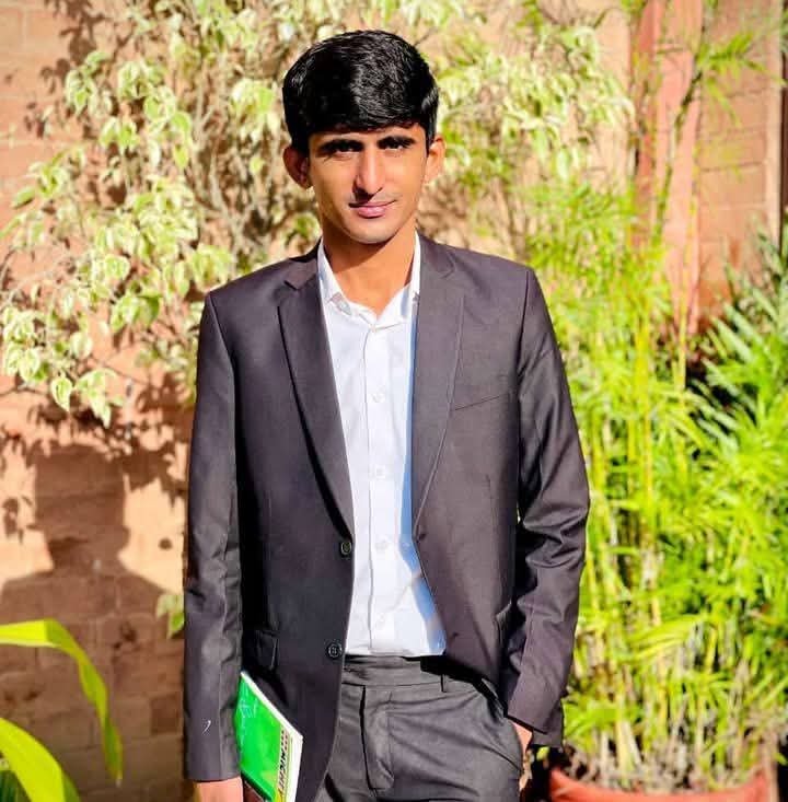 Meer Muhammad wearing a suit outdoors